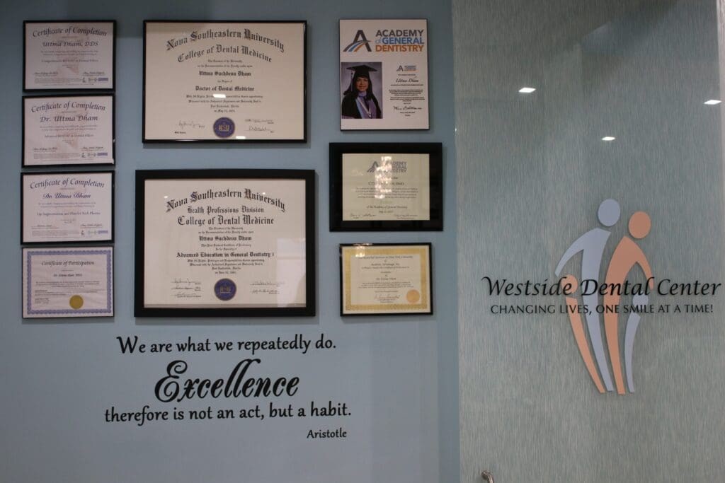 Diplomas and certificates on the office wall at Westside Dental Center