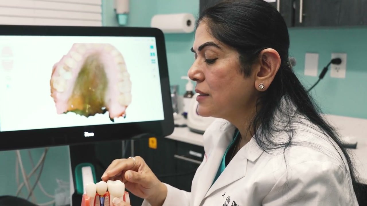 Dr. Uttma Dham explaining treatment options