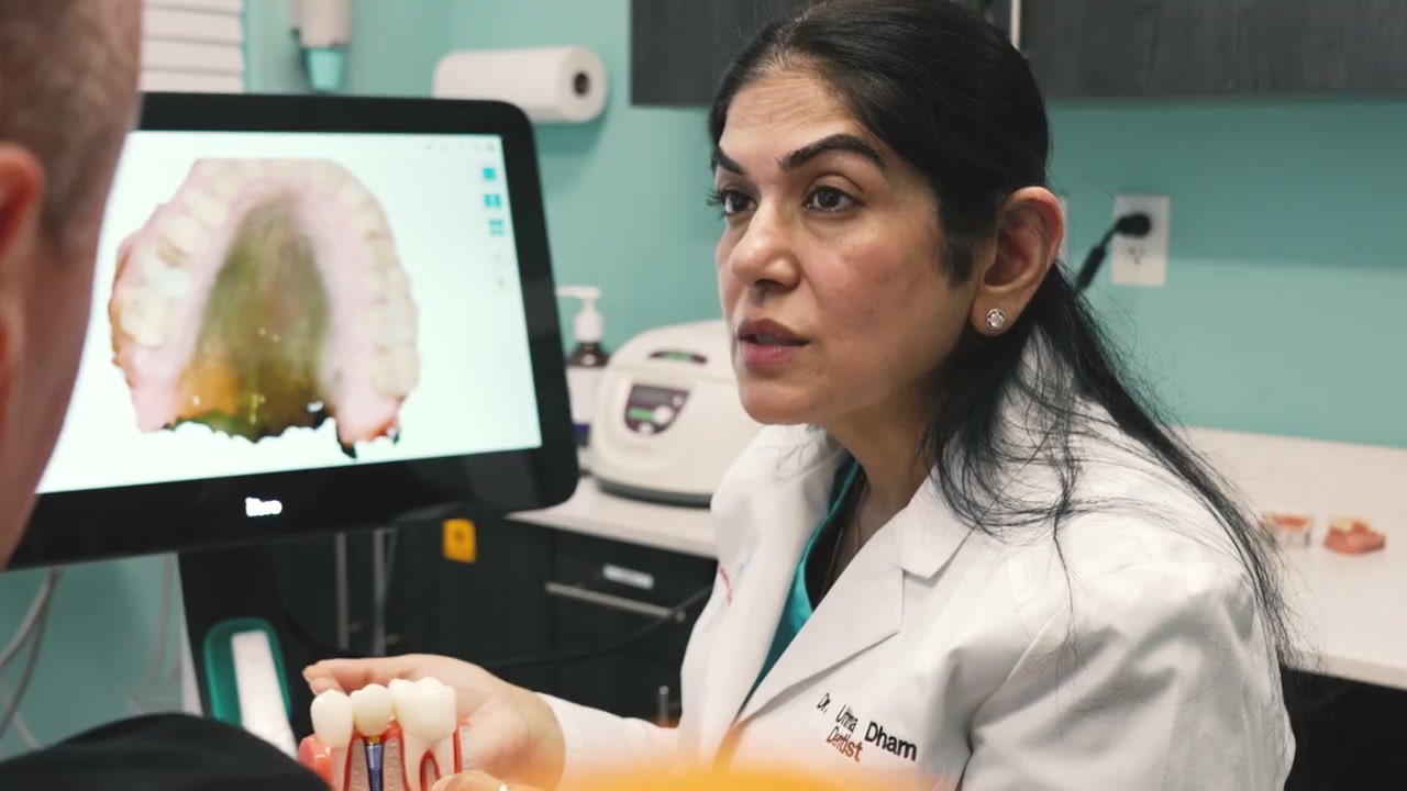Dr. Uttma Dham reviewing an iTero 3D scan