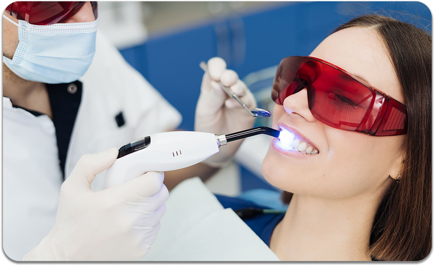 Laser dental treatment with the patient wearing protective eyewear