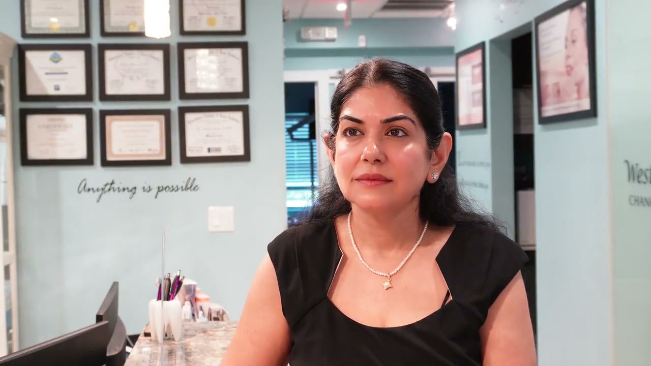 Dr. Uttma Dham explaining dental implants