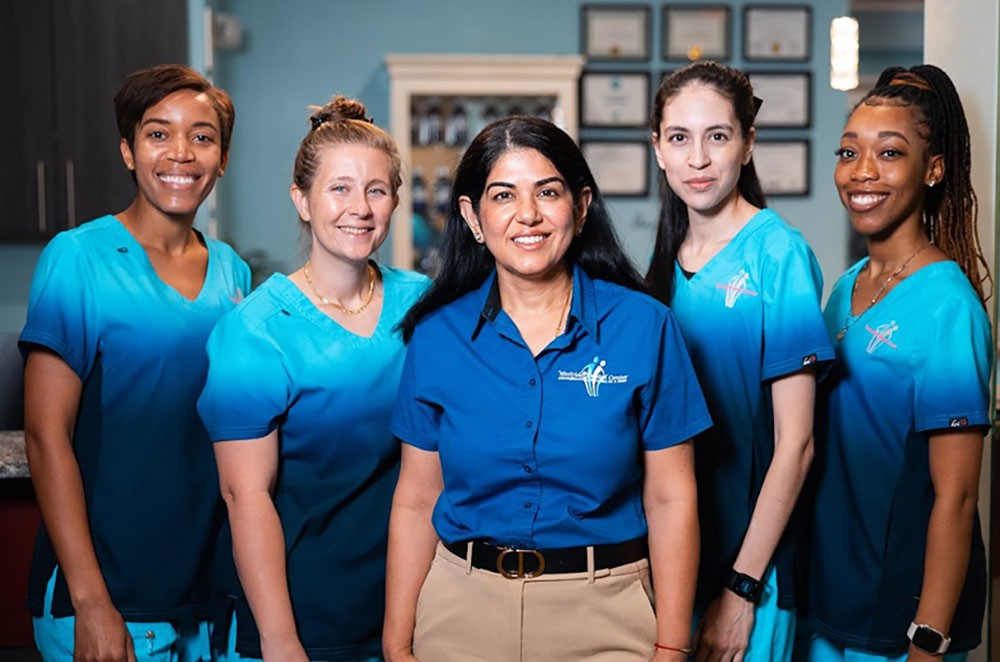 Westside Dental Center team standing together in the office